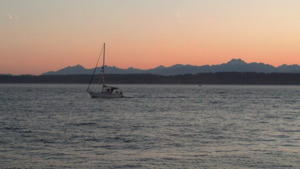 One of the quintessential shots, Ray's Boathouse. Olympic Mountains in the distance, a lone sailboat en route to the Locks.